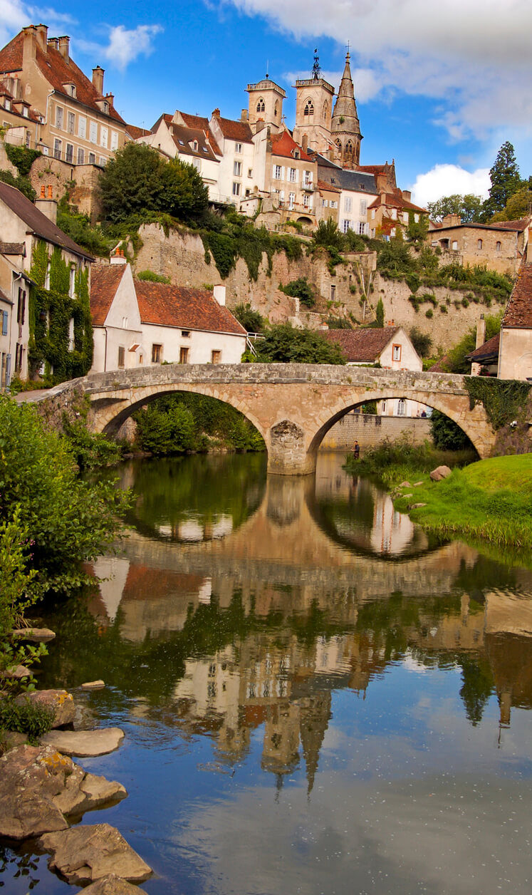 burgundy town on rocks river bridge